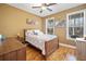 Bedroom featuring hardwood floors, neutral paint, a window view, and traditional furnishings at 138 Rutledge Rd, Temple, GA 30179