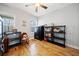 Versatile bonus room with hardwood floors, natural light, and shelving units at 138 Rutledge Rd, Temple, GA 30179