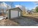Spacious outbuilding with a large roll-up door for versatile use and storage at 138 Rutledge Rd, Temple, GA 30179