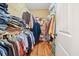 Walk-in closet with hardwood floors and plenty of storage space for clothes and accessories at 138 Rutledge Rd, Temple, GA 30179