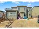 A spacious backyard features outdoor seating and play area; perfect for Gathering gatherings at 2145 Red Barn Ct, Cumming, GA 30040