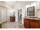 A spacious bathroom with double vanities, granite countertops and tile flooring, adjacent to a bedroom at 2145 Red Barn Ct, Cumming, GA 30040
