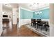 Open-concept layout showcasing the dining room, living area, and hardwood floors at 2145 Red Barn Ct, Cumming, GA 30040