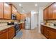 Modern kitchen with stainless steel appliances, granite countertops, and hardwood flooring at 2145 Red Barn Ct, Cumming, GA 30040