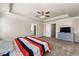 Spacious main bedroom with a tray ceiling, ceiling fan, and lots of natural light at 2145 Red Barn Ct, Cumming, GA 30040