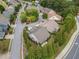 Aerial view of a home surrounded by mature trees and located on a quiet street at 3124 Bentgrass Ln, Kennesaw, GA 30144