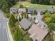 Beautiful aerial view of homes nestled in a golf course community with mature trees at 3124 Bentgrass Ln, Kennesaw, GA 30144