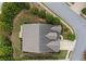 Drone's-eye view of the house showing roof, surrounding yard, and landscaping at 3124 Bentgrass Ln, Kennesaw, GA 30144
