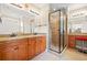 A full bathroom features granite countertops, double sinks, and a glass-enclosed shower at 3124 Bentgrass Ln, Kennesaw, GA 30144