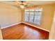 Bedroom with hardwood floors, large window and neutral paint at 3124 Bentgrass Ln, Kennesaw, GA 30144