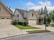 Charming two-story home with a two-car garage, stone accents, and mature landscaping at 3124 Bentgrass Ln, Kennesaw, GA 30144