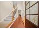 Elegant foyer with hardwood floors, high ceilings, and stairway with iron balusters at 3124 Bentgrass Ln, Kennesaw, GA 30144