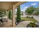 Inviting covered front porch with stylish furniture and view of the manicured front yard at 3124 Bentgrass Ln, Kennesaw, GA 30144
