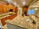 Kitchen boasts granite counters, custom cabinets, stainless steel appliances and tile floors at 3124 Bentgrass Ln, Kennesaw, GA 30144