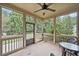 Screened porch with ceiling fan overlooking the backyard at 3124 Bentgrass Ln, Kennesaw, GA 30144