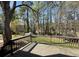 This backyard has a deck and mature trees, making it a great place to entertain at 445 Royal Oaks Ter, Stone Mountain, GA 30087