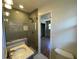 Renovated bathroom featuring a modern shower, and neutral tile, offering a clean and stylish space at 445 Royal Oaks Ter, Stone Mountain, GA 30087