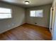 Inviting bedroom with wood floors and double windows, providing ample light and a cozy feel at 445 Royal Oaks Ter, Stone Mountain, GA 30087