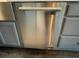 Close up of a stainless steel dishwasher with shaker-style cabinets at 445 Royal Oaks Ter, Stone Mountain, GA 30087