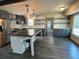Modern kitchen features a center island, stainless steel appliances and subway tile backsplash at 445 Royal Oaks Ter, Stone Mountain, GA 30087