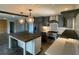 This modern kitchen offers stainless steel appliances, granite countertops, and a central island at 445 Royal Oaks Ter, Stone Mountain, GA 30087
