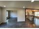 Open floor plan featuring hardwood floors connecting a dining area and kitchen with an island and bar stools at 445 Royal Oaks Ter, Stone Mountain, GA 30087