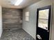Practical mud room featuring stylish tile flooring, wood paneling, and an exterior door at 445 Royal Oaks Ter, Stone Mountain, GA 30087