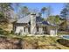 The backyard boasts a private outdoor space with a patio area, a trampoline, and lush greenery at 5163 Holly Springs Dr, Douglasville, GA 30135