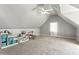 Upstairs bonus room with carpet, vaulted ceiling, and natural light at 5163 Holly Springs Dr, Douglasville, GA 30135