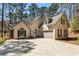 Elegant home with arched windows, attached two car garage, and beautiful curb appeal at 5163 Holly Springs Dr, Douglasville, GA 30135