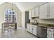 Eat-in kitchen with stainless steel appliances, granite countertops, and a large window at 5163 Holly Springs Dr, Douglasville, GA 30135