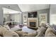 Bright living room features a cozy fireplace, comfortable seating, and ample natural light at 5163 Holly Springs Dr, Douglasville, GA 30135