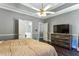 Main bedroom with hardwood floors, ceiling fan, and ensuite bathroom at 5163 Holly Springs Dr, Douglasville, GA 30135