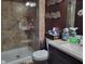 Bathroom featuring a glass shower and granite countertop at 198 Lexington Ct, Riverdale, GA 30274