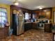 Spacious kitchen with dark cabinets and stainless steel appliances at 198 Lexington Ct, Riverdale, GA 30274