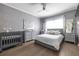 Serene bedroom with a full-sized bed, soft gray tones, and a coordinated furniture set at 240 Renaissance Ne Pkwy # 106, Atlanta, GA 30308