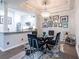 Bright dining area featuring a modern chandelier, glass table, and stylish decor at 240 Renaissance Ne Pkwy # 106, Atlanta, GA 30308