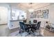 Bright dining area featuring a modern chandelier, glass table, and stylish decor at 240 Renaissance Ne Pkwy # 106, Atlanta, GA 30308