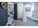 Inviting entryway featuring hardwood floors, updated lighting, and an open floor plan at 240 Renaissance Ne Pkwy # 106, Atlanta, GA 30308