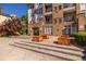 Elegant brick building with balconies and decorative wooden planters at 240 Renaissance Ne Pkwy # 106, Atlanta, GA 30308