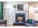Elegant fireplace with decorative mantel and cozy seating area at 240 Renaissance Ne Pkwy # 106, Atlanta, GA 30308