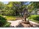 Manicured grounds with lush landscaping and a peaceful courtyard with a water feature at 240 Renaissance Ne Pkwy # 106, Atlanta, GA 30308
