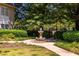A serene courtyard with a beautiful fountain adds a touch of elegance to the lush landscaping at 240 Renaissance Ne Pkwy # 106, Atlanta, GA 30308