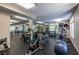 Spacious gym featuring modern fitness equipment, mirrors, and rubber floor at 240 Renaissance Ne Pkwy # 106, Atlanta, GA 30308