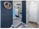 Inviting hallway leading to a home office space with built-in shelving at 240 Renaissance Ne Pkwy # 106, Atlanta, GA 30308