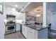 Beautifully updated kitchen featuring stainless steel appliances and stone countertops at 240 Renaissance Ne Pkwy # 106, Atlanta, GA 30308