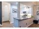 Kitchen featuring white cabinets, granite countertops, and modern fixtures at 240 Renaissance Ne Pkwy # 106, Atlanta, GA 30308