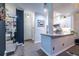 View into the kitchen featuring white cabinets, stone countertops and stainless steel appliances at 240 Renaissance Ne Pkwy # 106, Atlanta, GA 30308