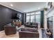 Inviting living room with stylish seating, fireplace, and large windows for natural light at 240 Renaissance Ne Pkwy # 106, Atlanta, GA 30308