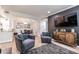 Open-concept living and dining area with sleek furnishings and modern decor at 240 Renaissance Ne Pkwy # 106, Atlanta, GA 30308